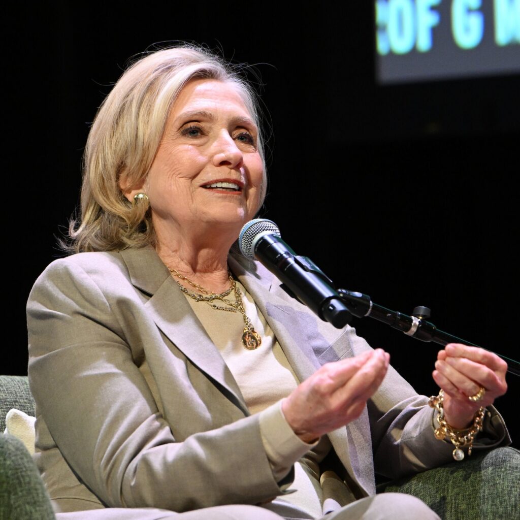 Hillary Clinton Steps to the Podcast Mic as Midterms Approach