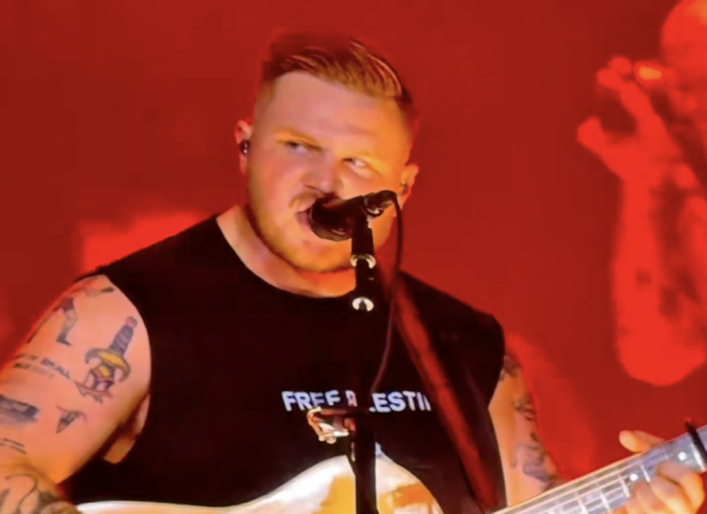 Zach Bryan Wears ‘Free Palestine’ Shirt While Headlining Robert Kraft’s Gillette Stadium; Drummer Honors Slain Palestinian Girl